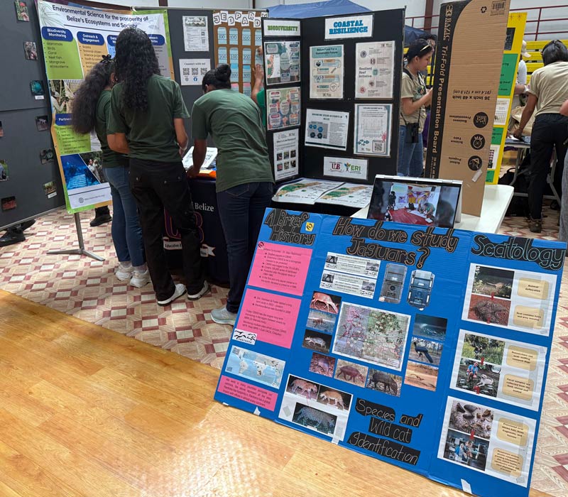 Students gather at an educational booth