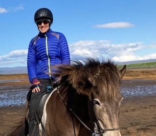 woman riding on a horse