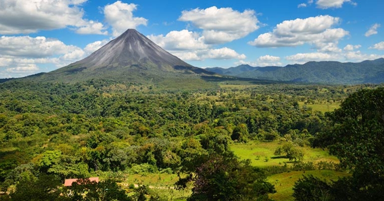 Arenal Volcano with forested landscape in the foreground