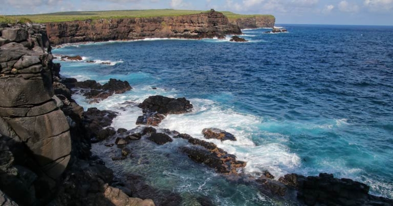 Shot of waves breaking on rocky coast