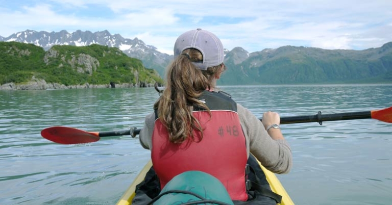 A traveler kayaking