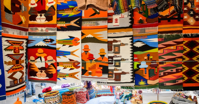Intricate and colorful woven textiles at Otavalo Market in Ecuador