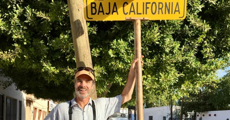 Kevin with Baja street sign