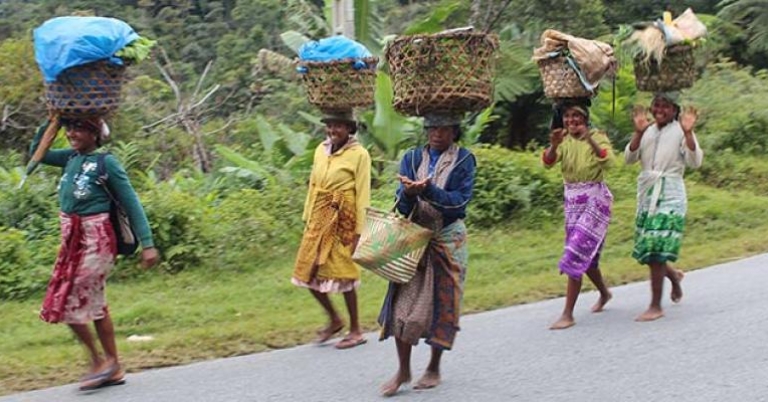 Malagasy women walking along the road