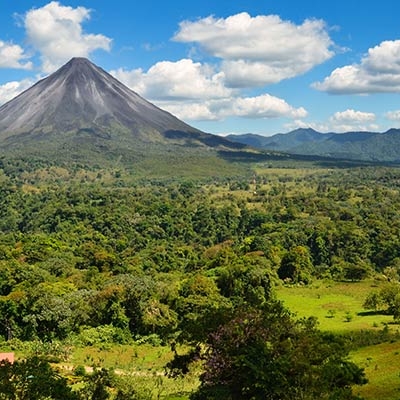 Arenal Volcano with forested landscape in the foreground