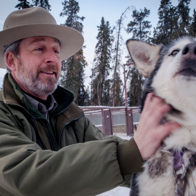 Park superintendent with sled dog in Alaska