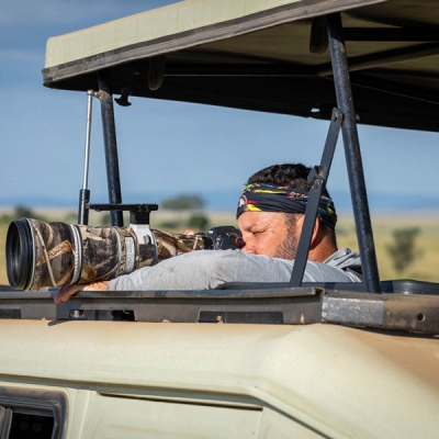 Wildlife photographer in vehicle