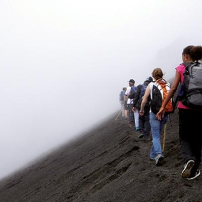 Students hiking through the mist