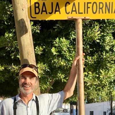Kevin with Baja street sign