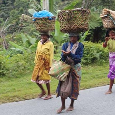 Malagasy women walking along the road